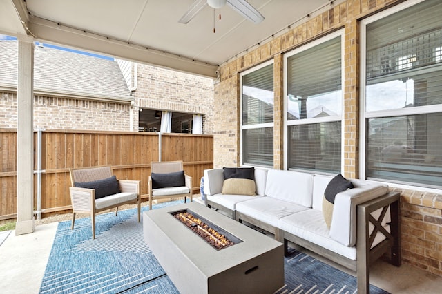 view of patio / terrace featuring an outdoor living space with a fire pit and ceiling fan