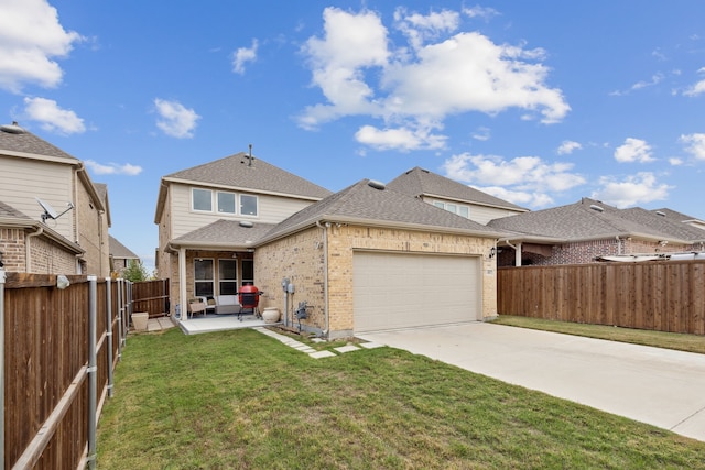 view of front facade featuring a garage, a patio area, and a front yard