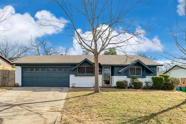 ranch-style house with a garage and a front lawn