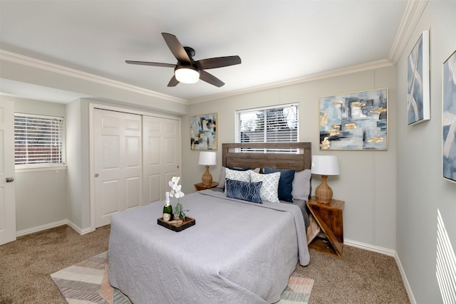 bedroom featuring crown molding, light colored carpet, ceiling fan, and a closet