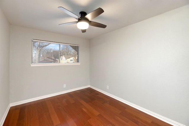 spare room with hardwood / wood-style floors and ceiling fan