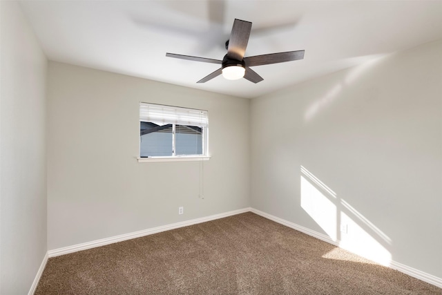 unfurnished room featuring ceiling fan and carpet flooring