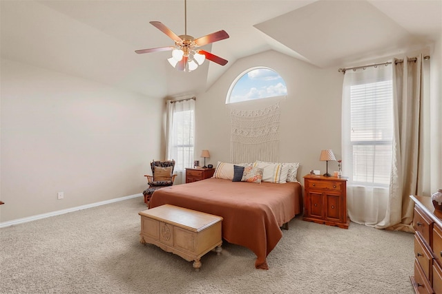 carpeted bedroom with ceiling fan and lofted ceiling