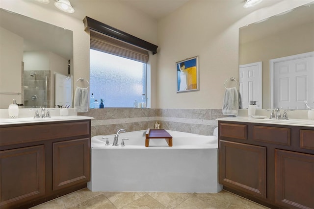 bathroom with vanity, shower with separate bathtub, and tile patterned floors