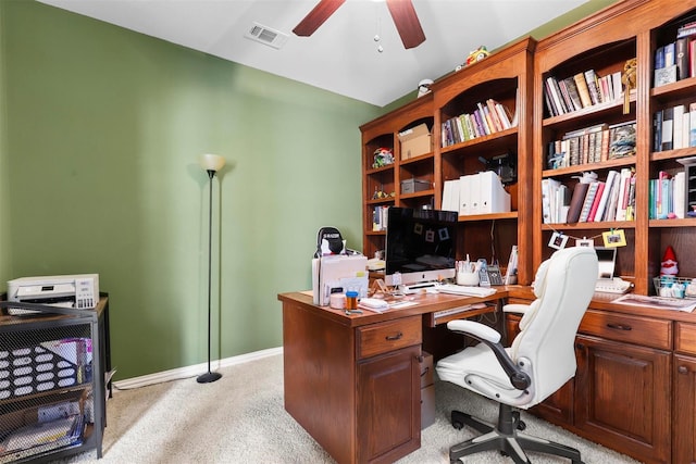 home office with ceiling fan and light carpet