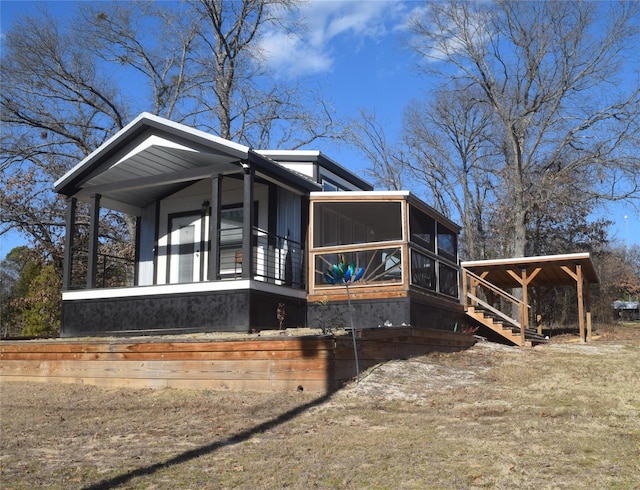 view of side of property with a sunroom