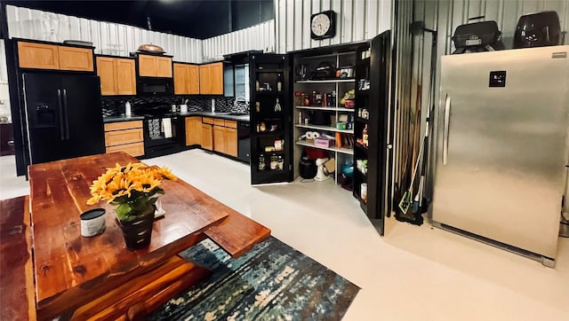 kitchen with sink and black appliances