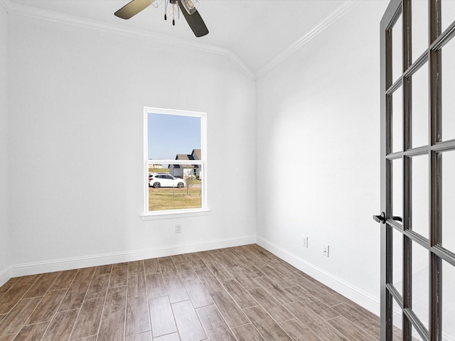 spare room featuring ceiling fan, ornamental molding, and vaulted ceiling