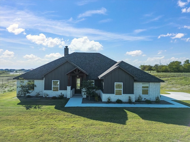 view of front of home with a front yard