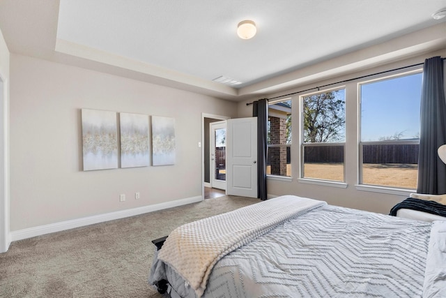 carpeted bedroom featuring visible vents and baseboards