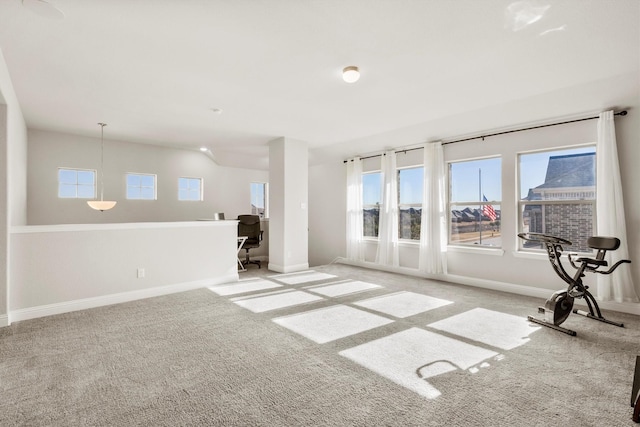 spare room with light carpet and baseboards