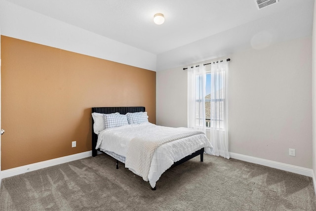 bedroom featuring carpet flooring, visible vents, and baseboards