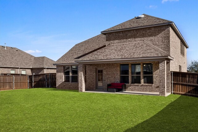 view of front of property featuring a garage and a front yard