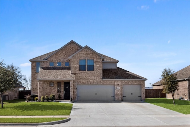 traditional-style home with driveway, fence, a front lawn, and brick siding