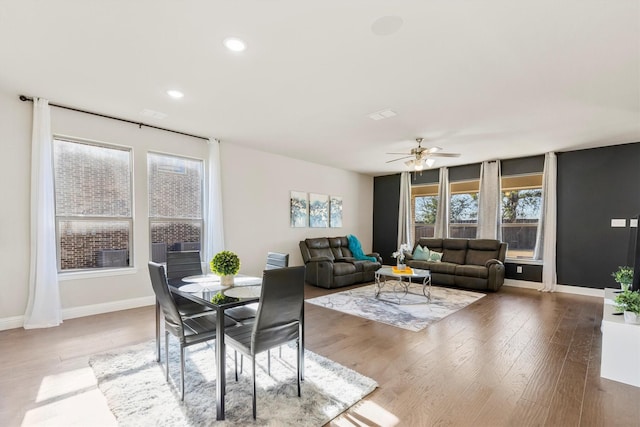 dining area featuring ceiling fan, baseboards, wood finished floors, and recessed lighting