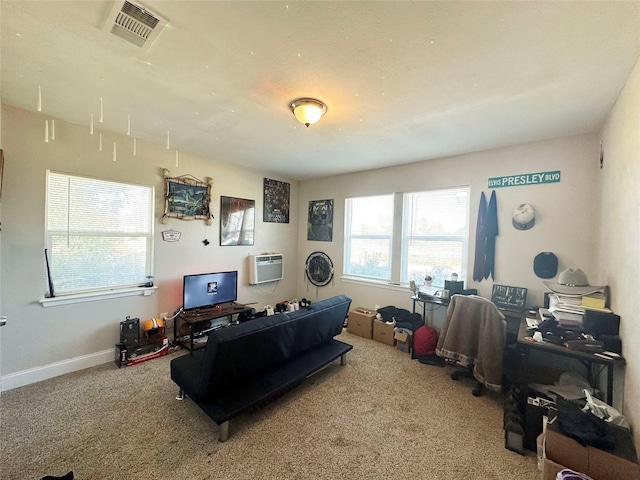 carpeted living room featuring a wall unit AC