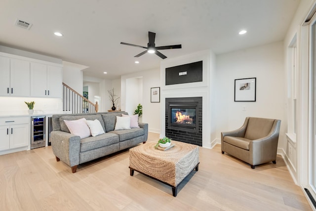 13590 Park Harbor Dr, Eustace, TX 75124 - living area with wine cooler, light wood-style floors, stairs, recessed lighting, and ceiling fan