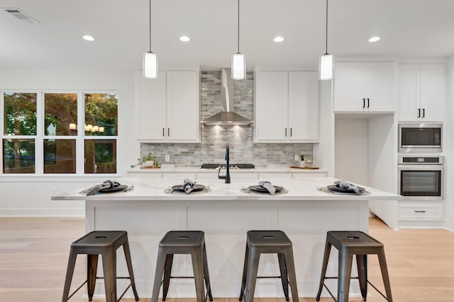 13590 Park Harbor Dr, Eustace, TX 75124 - kitchen with oven, wall chimney exhaust hood, built in microwave, backsplash, and white cabinets