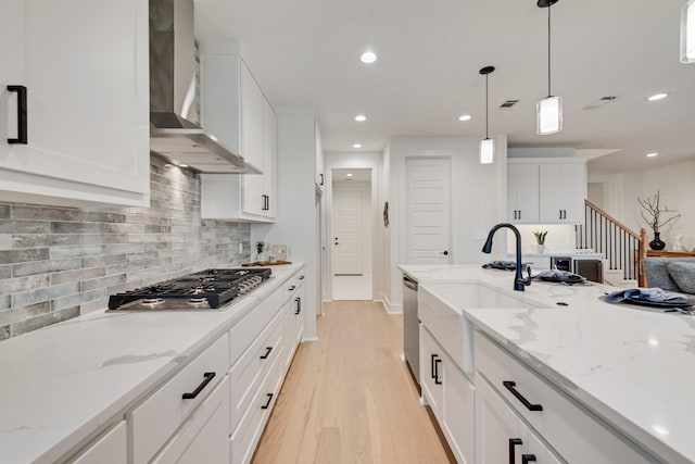 13590 Park Harbor Dr, Eustace, TX 75124 - kitchen featuring wall chimney exhaust hood, stainless steel appliances, a sink, light wood-style floors, and recessed lighting
