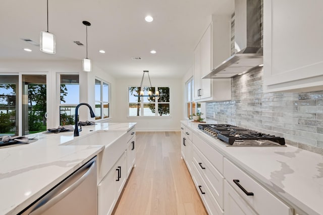 13590 Park Harbor Dr, Eustace, TX 75124 - kitchen featuring wall chimney exhaust hood, stainless steel appliances, light wood-style floors, recessed lighting, and a sink