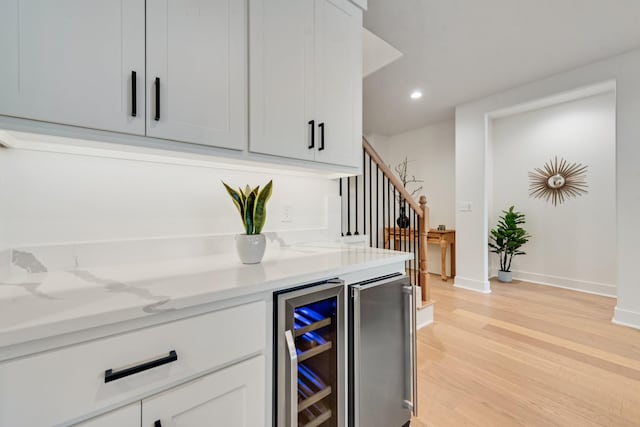13590 Park Harbor Dr, Eustace, TX 75124 - indoor dry bar with beverage cooler, light wood finished floors, stairway, baseboards, and recessed lighting