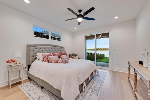 13590 Park Harbor Dr, Eustace, TX 75124 - bedroom featuring access to exterior, light wood-style floors, recessed lighting, baseboards, and a water view