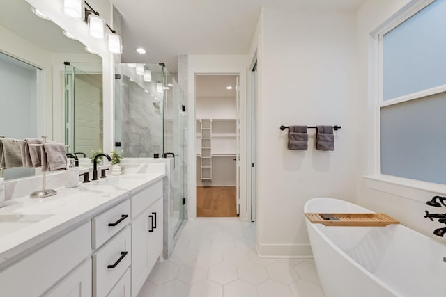 13590 Park Harbor Dr, Eustace, TX 75124 - full bathroom featuring a shower stall, a spacious closet, a freestanding tub, tile patterned flooring, and recessed lighting