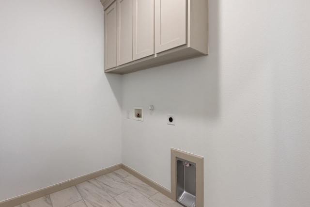 washroom with cabinets, gas dryer hookup, hookup for a washing machine, and hookup for an electric dryer