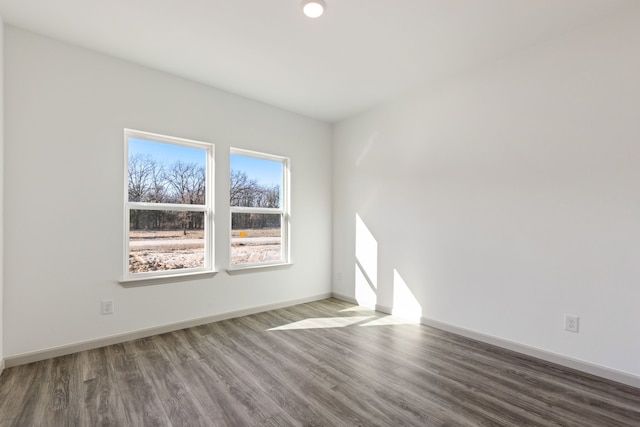 unfurnished room with hardwood / wood-style floors