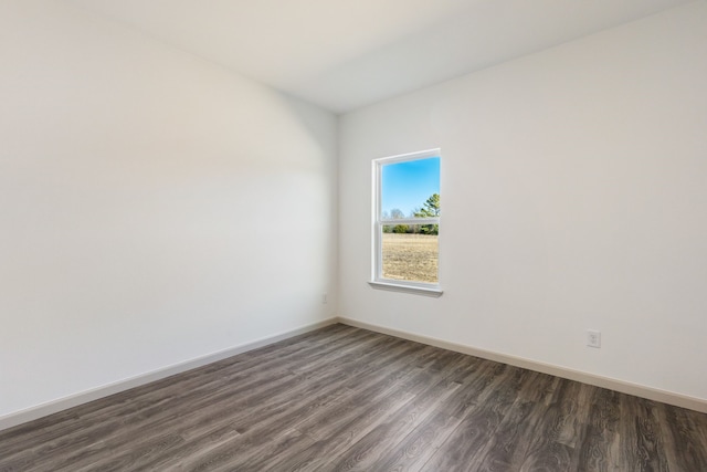 spare room featuring dark hardwood / wood-style floors