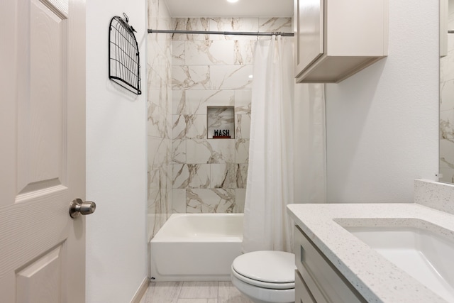 full bathroom with vanity, toilet, and shower / bath combo with shower curtain