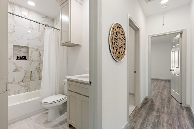 full bathroom featuring vanity, toilet, and shower / bath combo with shower curtain