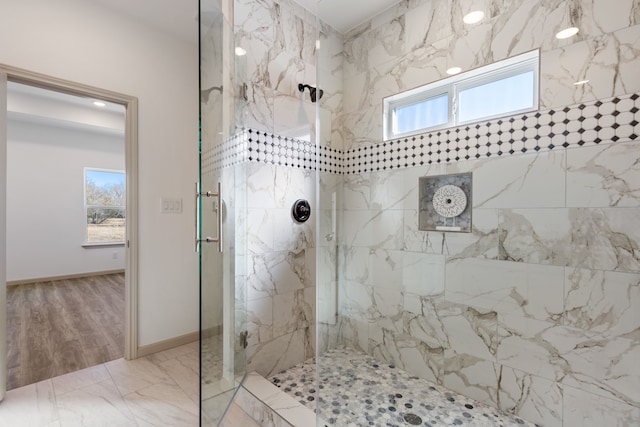 bathroom with tiled shower