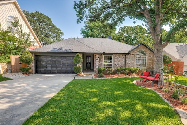 ranch-style home with a garage and a front lawn