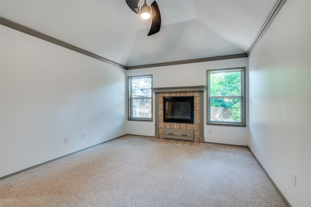 unfurnished living room featuring crown molding, ceiling fan, vaulted ceiling, and light carpet