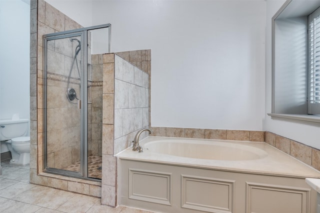 bathroom featuring tile patterned flooring, plus walk in shower, and toilet