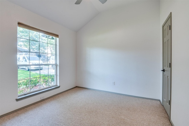 carpeted empty room featuring lofted ceiling and ceiling fan