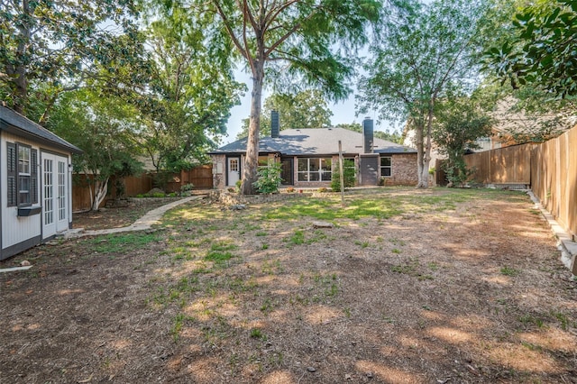 view of yard featuring french doors