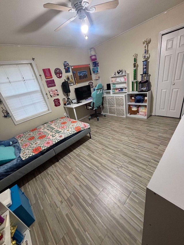 bedroom featuring hardwood / wood-style flooring and ceiling fan