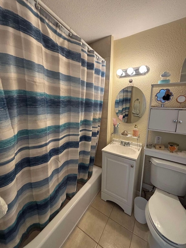 full bathroom with shower / bath combination with curtain, tile patterned flooring, vanity, toilet, and a textured ceiling