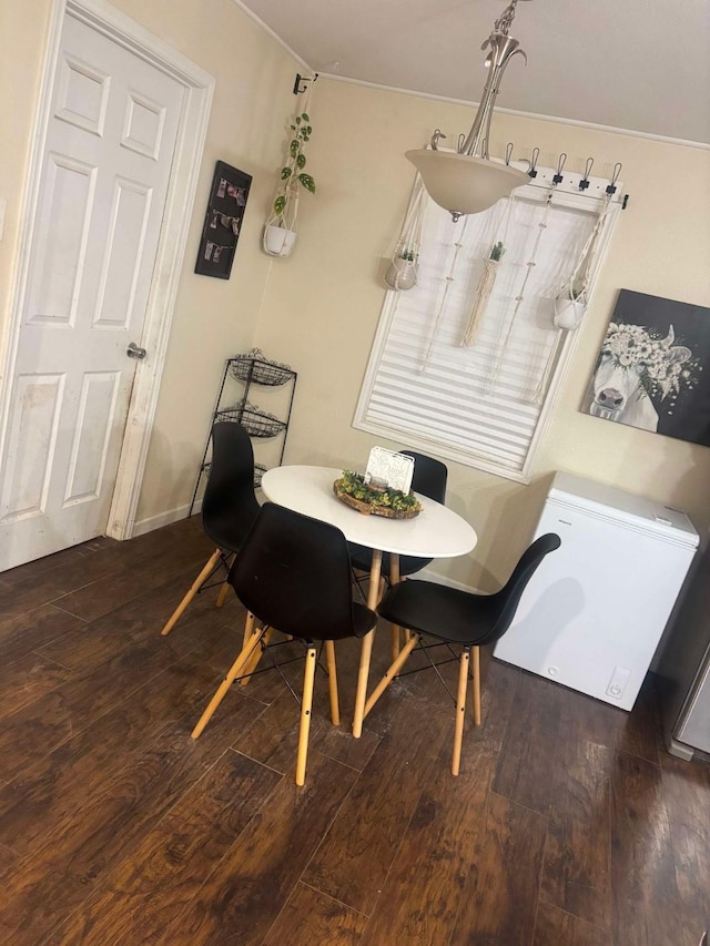 dining area featuring dark hardwood / wood-style floors