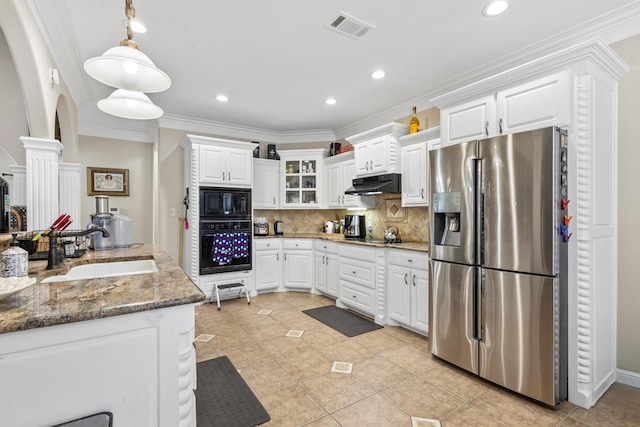 kitchen with tasteful backsplash, white cabinets, dark stone countertops, and black appliances