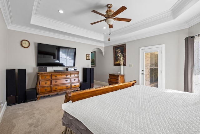 bedroom featuring carpet floors, access to outside, a raised ceiling, and ceiling fan