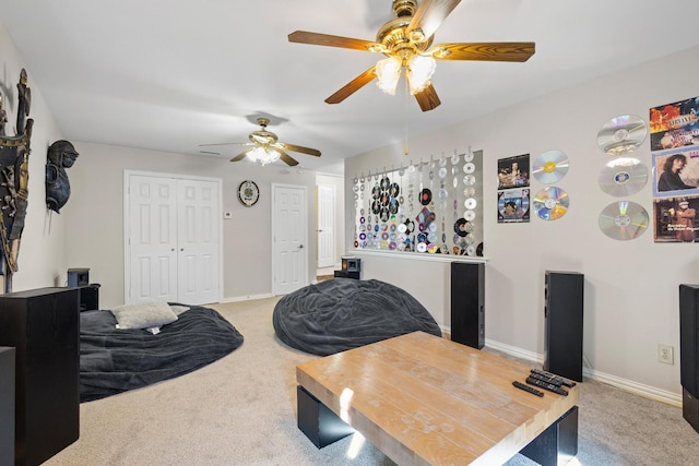 interior space featuring ceiling fan and a closet