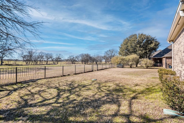 view of yard with a rural view