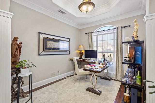 office area featuring hardwood / wood-style flooring, ornamental molding, and decorative columns