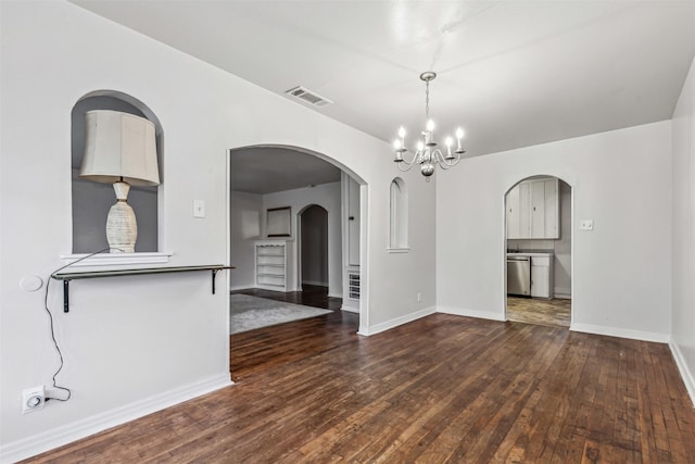 2325 Halbert St, Fort Worth, TX 76112 - empty room featuring wood-type flooring, a chandelier, and arched walkways