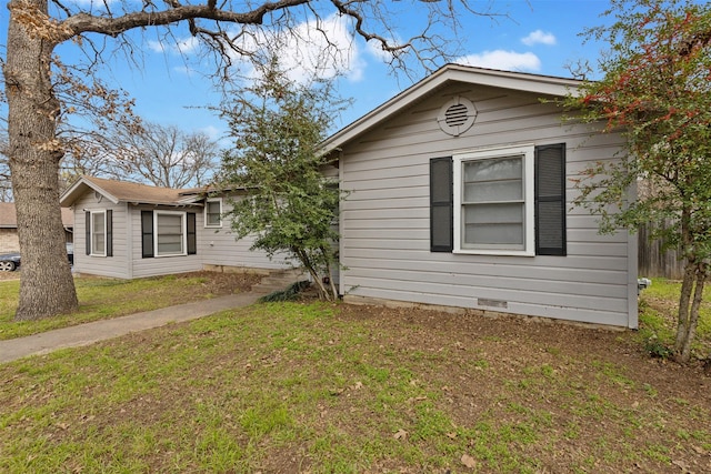 view of property exterior with a yard