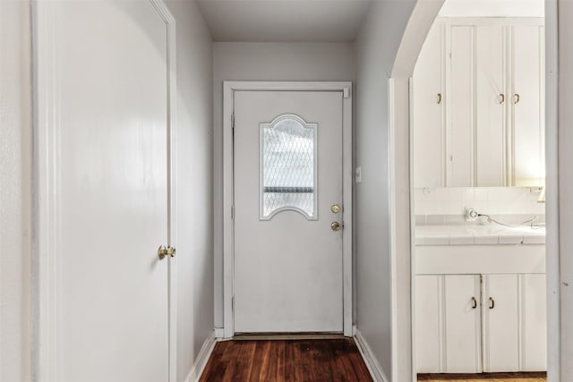 doorway featuring dark hardwood / wood-style floors