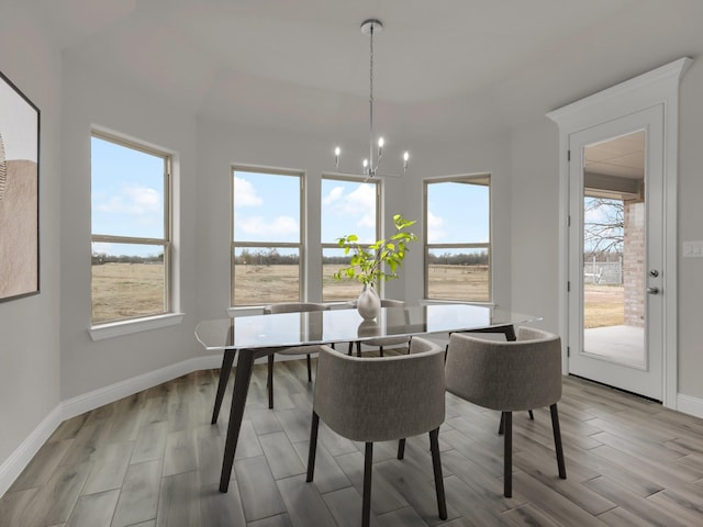 dining room with a wealth of natural light and a chandelier